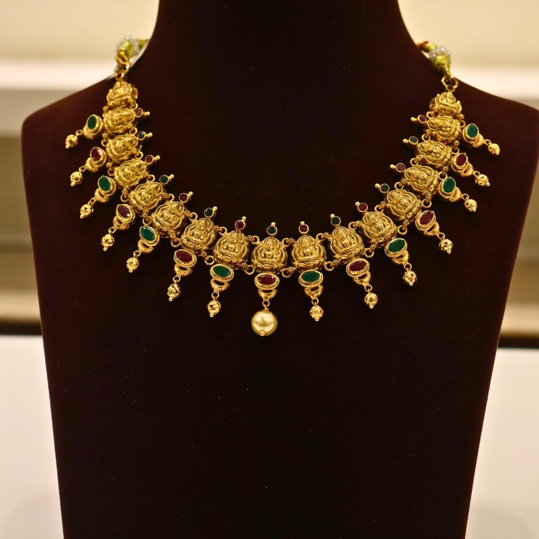 22KT Gold Lakshmi Necklace with Ruby & Green Stone Work (HUID Hallmarked) – Premium Bridal Collection (30.83g)